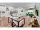 Bright living room with hardwood floors, stylish furniture, and a sliding glass door at 19272 Blue Pond Dr, Lutz, FL 33558