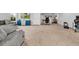 View of living room, features carpeted floor, neutral paint, desk/office space and furniture at 19272 Blue Pond Dr, Lutz, FL 33558