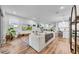 Inviting living room featuring hardwood floors, ample seating, and abundant natural light at 19272 Blue Pond Dr, Lutz, FL 33558