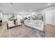 Open-concept living room flowing to kitchen, complete with stylish rug and modern furniture at 19272 Blue Pond Dr, Lutz, FL 33558