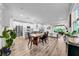Open-concept living space with stainless steel appliances, island seating, and natural light at 19272 Blue Pond Dr, Lutz, FL 33558