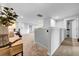 Open loft area with a home office, bookshelves, and natural light, perfect for a flexible living space at 19272 Blue Pond Dr, Lutz, FL 33558
