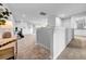View of carpeted loft featuring built-in bookshelves, recessed lighting, and neutral color scheme at 19272 Blue Pond Dr, Lutz, FL 33558