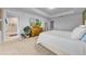 Comfortable main bedroom with tray ceilings and a king bed, leading into the main bathroom at 19272 Blue Pond Dr, Lutz, FL 33558