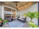 Cozy patio with ceiling fan, string lights, outdoor seating and views of the backyard at 19272 Blue Pond Dr, Lutz, FL 33558