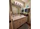 Bathroom featuring a wide mirror, updated vanity, and stylish decor at 2014 Nancy Ave, Lutz, FL 33548