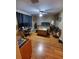 Bedroom showcasing wood laminate flooring, ceiling fan, and desk area at 2014 Nancy Ave, Lutz, FL 33548
