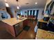 Open-concept kitchen and living area showcasing an island and modern appliances at 2014 Nancy Ave, Lutz, FL 33548