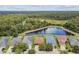 Aerial view of several homes showcasing pond and backyard views at 20244 Merry Oak Ave, Tampa, FL 33647