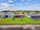 Aerial view showcasing homes with spacious backyards and a scenic pond at 20244 Merry Oak Ave, Tampa, FL 33647