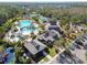 A stunning aerial view showcases community amenities including pools, tennis courts, and landscaped areas, perfect for an active lifestyle at 20244 Merry Oak Ave, Tampa, FL 33647