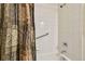 Clean bathroom featuring a shower with a grab bar and light-colored tiles at 20244 Merry Oak Ave, Tampa, FL 33647