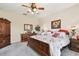Spacious bedroom with elegant furnishings, including a wooden bed frame and matching dresser at 20244 Merry Oak Ave, Tampa, FL 33647