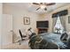 Inviting bedroom featuring a ceiling fan, large window, and exercise equipment at 20244 Merry Oak Ave, Tampa, FL 33647