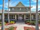 Stately community clubhouse framed by palm trees and a well-manicured brick walkway at 20244 Merry Oak Ave, Tampa, FL 33647