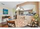 Cozy dining area with marble-topped table and decorative furnishings adjacent to the living area at 20244 Merry Oak Ave, Tampa, FL 33647