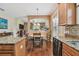 Kitchen view with granite counters, stainless appliances, a casual dining area, and hardwood floors at 20244 Merry Oak Ave, Tampa, FL 33647