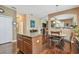 Open kitchen layout with a central island, and hardwood floors, connecting seamlessly to the dining area at 20244 Merry Oak Ave, Tampa, FL 33647