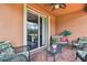 Inviting covered patio with outdoor seating and a view of the lush backyard at 20244 Merry Oak Ave, Tampa, FL 33647
