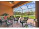 Cozy patio with comfortable seating arrangements and views of the serene backyard at 20244 Merry Oak Ave, Tampa, FL 33647