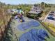 Aerial view of a community playground featuring play equipment, swings, and a slide, close to a clubhouse and pool at 20244 Merry Oak Ave, Tampa, FL 33647