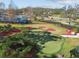 Aerial view of a putting green area with manicured landscaping, providing an enjoyable recreational space at 20244 Merry Oak Ave, Tampa, FL 33647