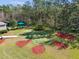 Aerial view of a backyard putting green and a covered gazebo for entertaining and enjoying outdoor recreation at 20244 Merry Oak Ave, Tampa, FL 33647