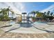 A colorful splash pad with sprinklers and slides, designed for enjoyment on a sunny day at 20244 Merry Oak Ave, Tampa, FL 33647