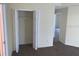 A bedroom closet featuring an open white door with a single top shelf and rod for practical storage at 205 Summer Sails Dr, Valrico, FL 33594