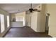Open-concept living area with neutral tones, ceiling fan, and abundant natural light at 205 Summer Sails Dr, Valrico, FL 33594
