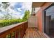Relaxing wooden porch with a view of green foliage in a private backyard at 2066 Sun Down Dr, Clearwater, FL 33763
