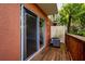 A relaxing, private wooden porch with an AC unit outside the sliding glass door at 2066 Sun Down Dr, Clearwater, FL 33763