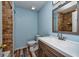 Bathroom with stone lined shower and modern vanity at 2066 Sun Down Dr, Clearwater, FL 33763