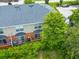 Aerial view of back of the multi-unit residential complex and associated parking at 2066 Sun Down Dr, Clearwater, FL 33763