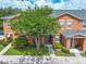 Charming two-story townhome with mature trees and well-maintained landscaping at 2066 Sun Down Dr, Clearwater, FL 33763