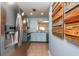 Bright kitchen features stainless steel appliances and blue cabinets at 2066 Sun Down Dr, Clearwater, FL 33763