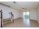 Bright living room featuring tile flooring and a sliding door with access to the outdoor space at 2066 Sun Down Dr, Clearwater, FL 33763