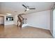 Spacious living room with tile flooring, stairs leading to the second level, and abundant natural light at 2066 Sun Down Dr, Clearwater, FL 33763