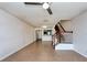 Open-concept living room featuring tile flooring, stairs, and easy access to kitchen area at 2066 Sun Down Dr, Clearwater, FL 33763