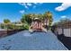 Community playground with a safe, rubber mulch ground and a secure fence at 2066 Sun Down Dr, Clearwater, FL 33763