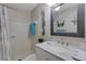 Bathroom featuring a marble vanity top, updated fixtures, and a shower at 221 Fernwood Cir # 221, Seminole, FL 33777
