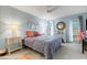 Bright bedroom featuring modern décor, with a ceiling fan and carpeted floors at 221 Fernwood Cir # 221, Seminole, FL 33777