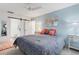 Bright bedroom with an en suite bathroom features modern décor and ample natural light at 221 Fernwood Cir # 221, Seminole, FL 33777