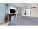 Bedroom with a TV and en suite bathroom features ample natural light and a ceiling fan at 221 Fernwood Cir # 221, Seminole, FL 33777