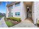 Exterior view of the building entrance showing stairs leading to the units, showcasing a welcoming arrival at 221 Fernwood Cir # 221, Seminole, FL 33777