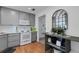 Functional kitchen featuring ample counter space, wooden floors and decorative window at 221 Fernwood Cir # 221, Seminole, FL 33777