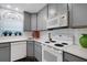 Well-equipped kitchen featuring modern appliances, bright countertops and warm wood look flooring at 221 Fernwood Cir # 221, Seminole, FL 33777