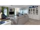 Comfortable living room with neutral tones, plush seating, and a sliding door to bring the outside in at 221 Fernwood Cir # 221, Seminole, FL 33777