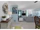Spacious living room with large TV, comfortable seating, and bright lighting, designed for relaxation at 221 Fernwood Cir # 221, Seminole, FL 33777