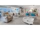 Spacious living room with a large seating area, white display cabinet, and ample natural light at 221 Fernwood Cir # 221, Seminole, FL 33777